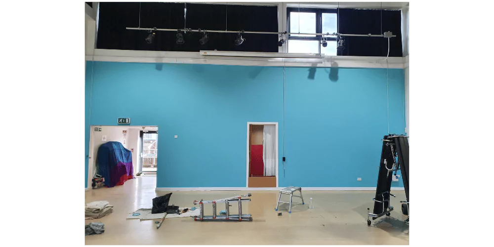 large commercial space with light rig and bright blue wall --- commercial painters and decorators, decorating contractors, eastcote paint and hardware, house painter and decorator, interior designer